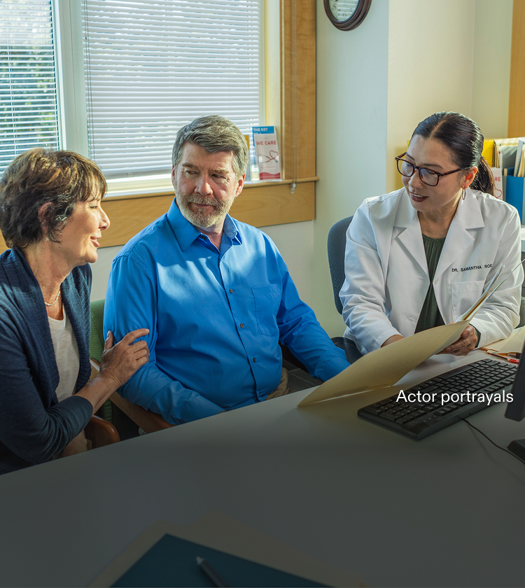 Actor portrayal of a doctor discussing with her patients