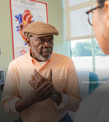 Actor portrayal of an older adult visiting the doctor