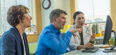 Patient on computer with wife