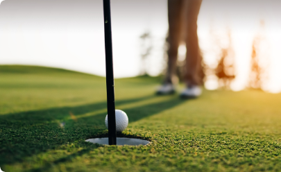 Patient golfing at sunset