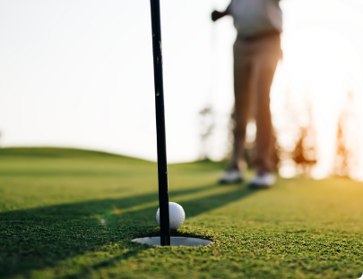 Patient golfing at sunset