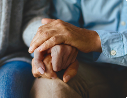 Patient holding hands with loved one