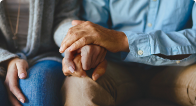 Patient holding hands with loved one