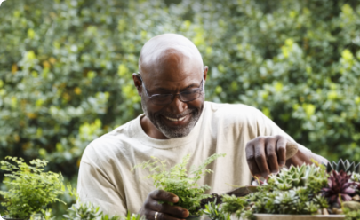 Patient smiling while gardening