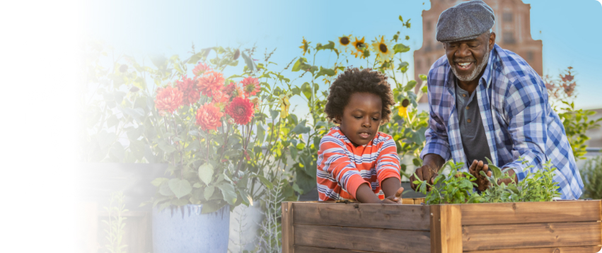 Actor portrayal of a grandfather gardening with his grandchild