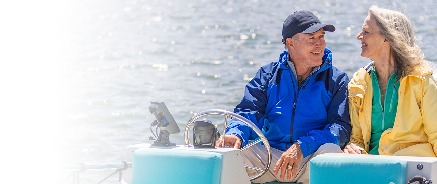 Actor portrayal of an older adult couple on a boat