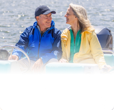 Actor portrayal of an older adult couple on a boat