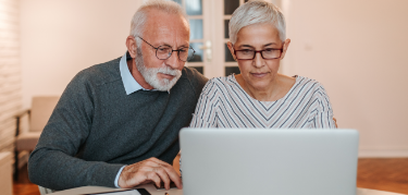 Patient on computer with wife